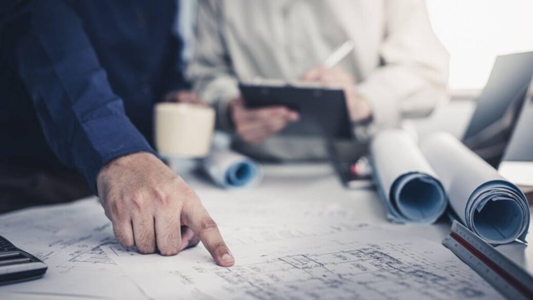 Engineers With Blueprint