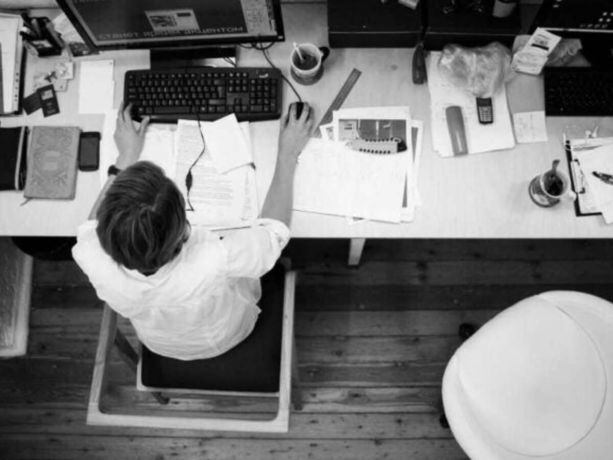 Black And Gray Photo Of Person In Front Of Computer Monitor Wallpaper Preview