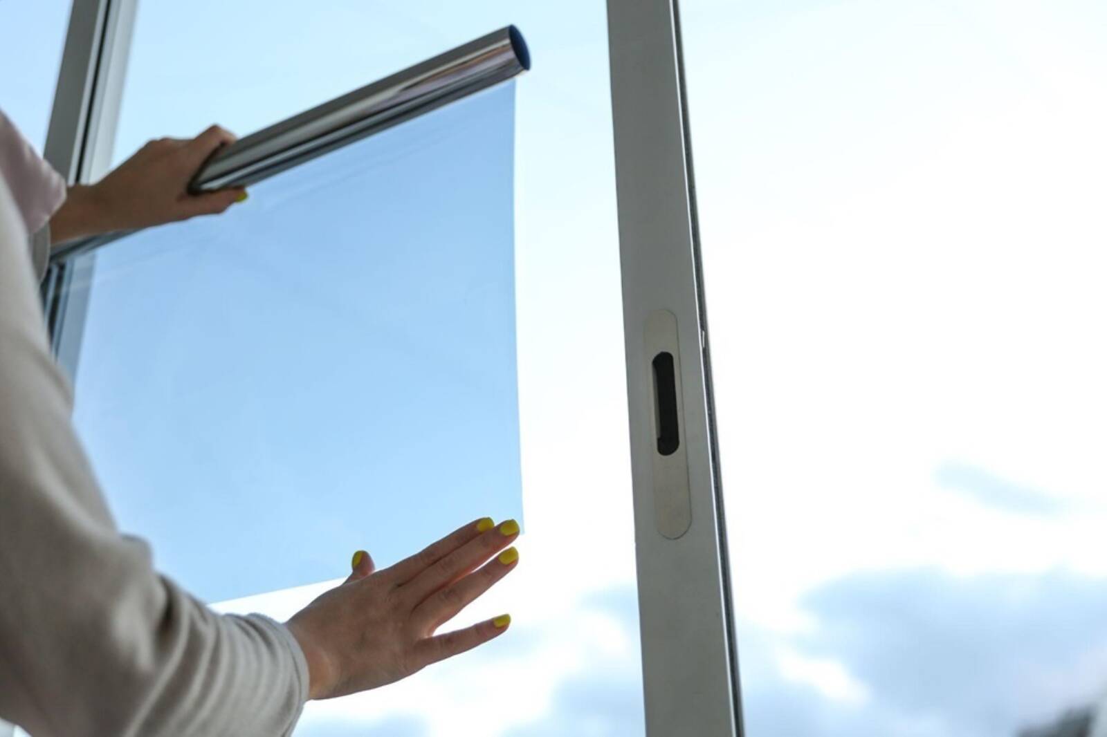 Man Installing Protective Window Film