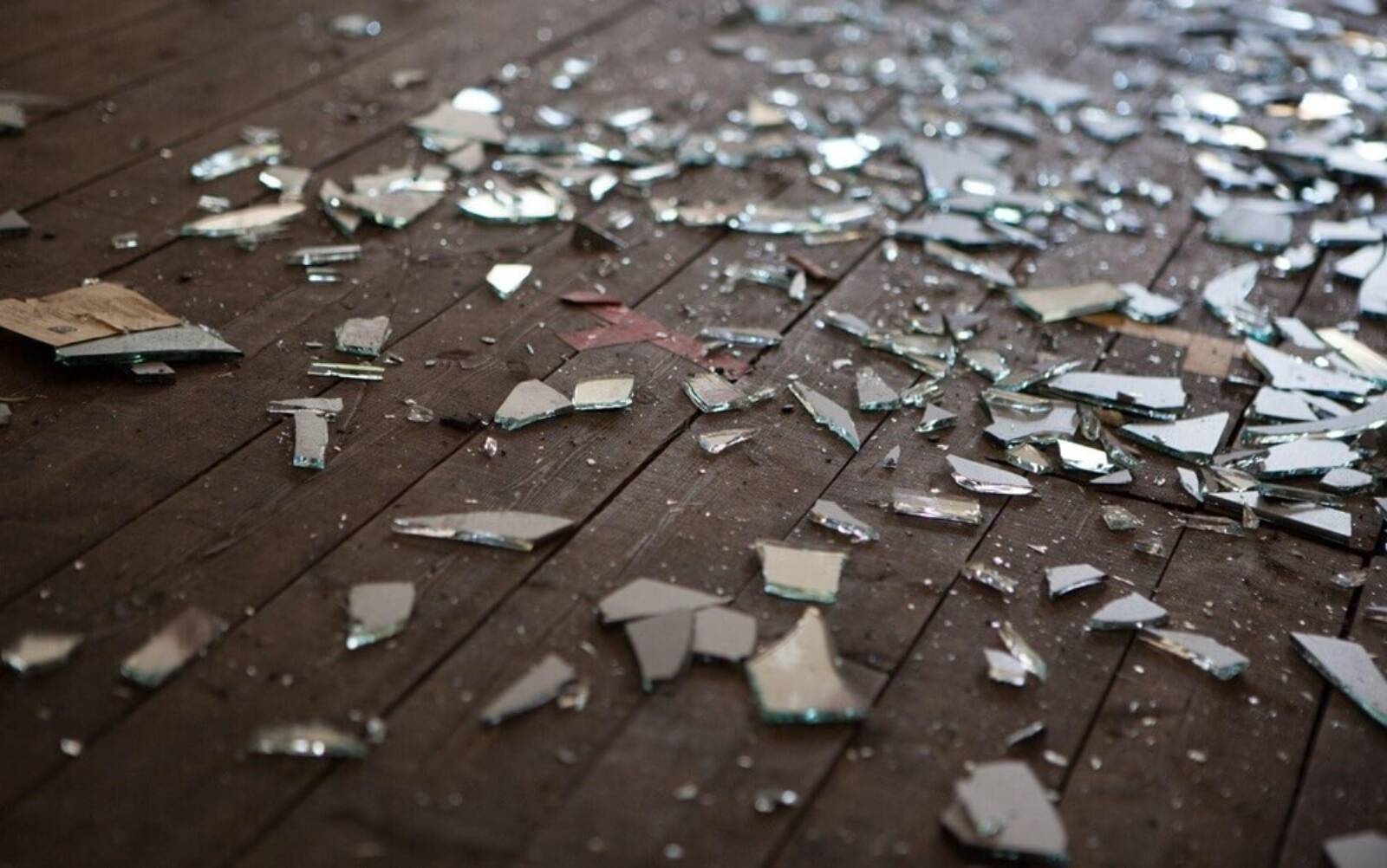 Shattered Glass On A Wooden Floor