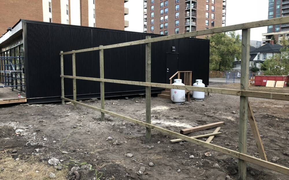 Battistella Nude Condo Sales Center Fence Construciton