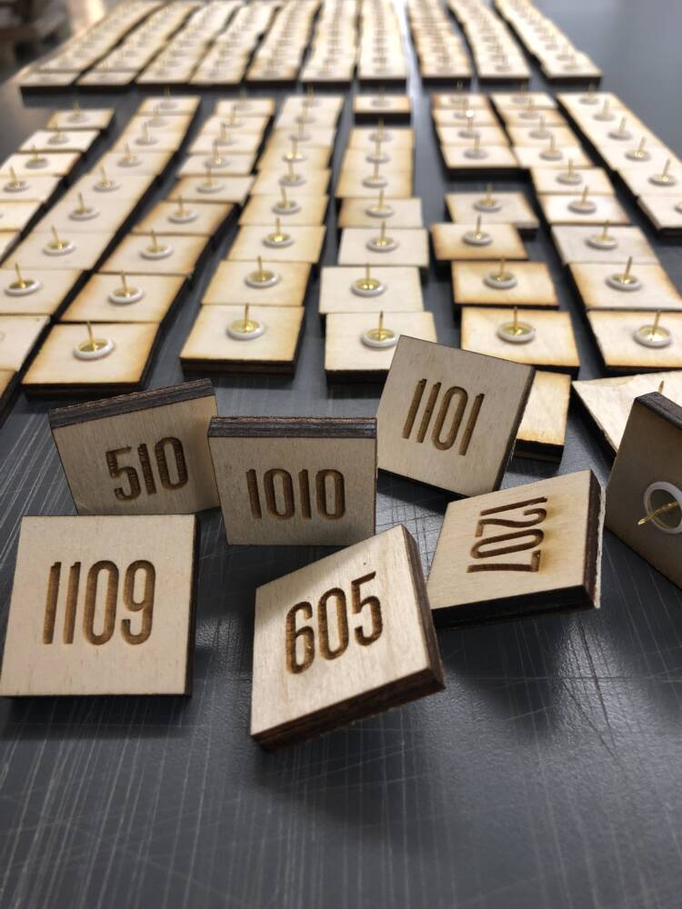 Laser Engraved Unit Numbers On Wood Squares With Tacks